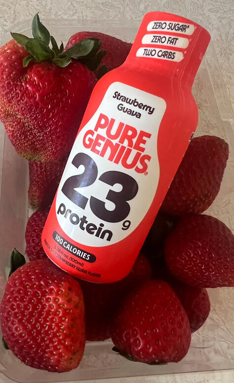 Pure Genius Strawberry Guava protein shot in a punnet of strawberries
