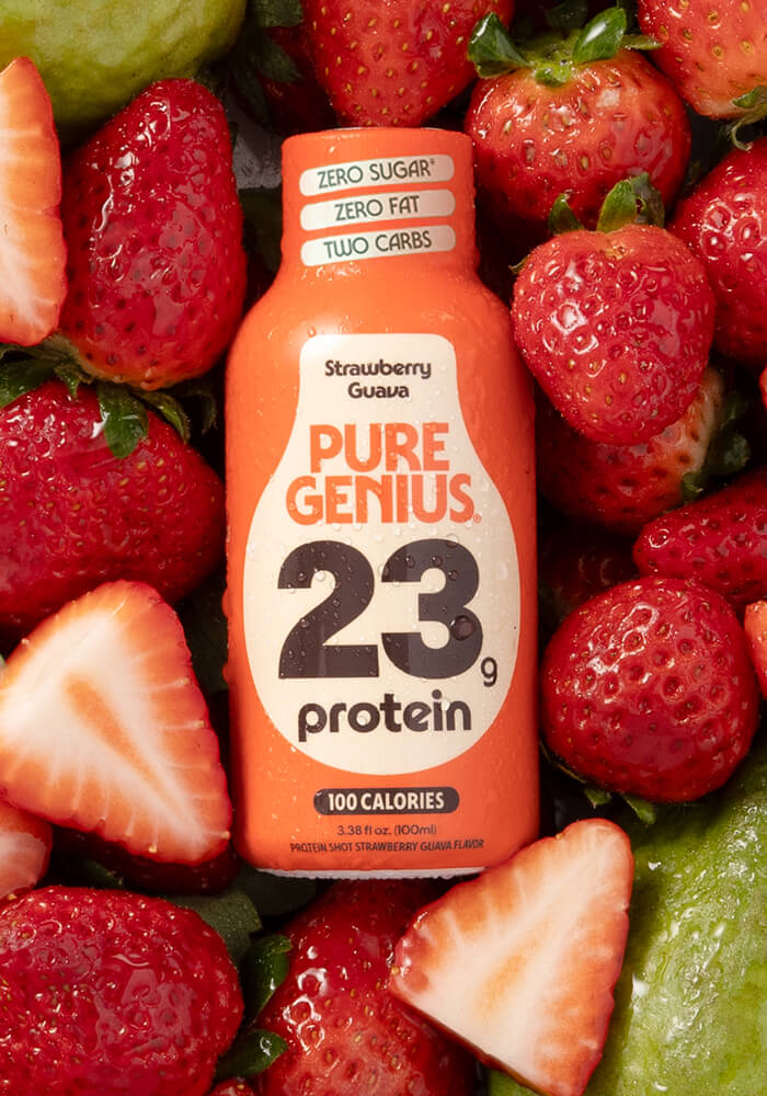 Pure Genius Strawberry Guava protein shot on fresh strawberries