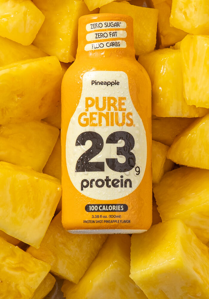 Pure Genius Pineapple protein shot on fresh pineapple chunks