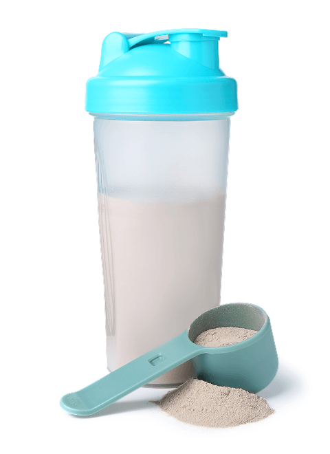 Shaker bottle with protein powder and a scoop